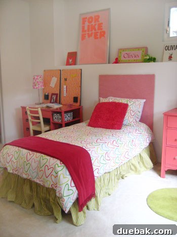 Olivia's room after the budget makeover, featuring a pink and white color scheme