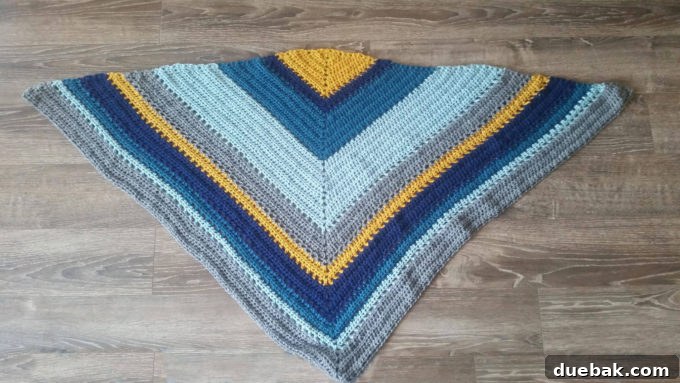 Statement Crochet Pointed Shawl 5 Friend Amy wearing a stunning oversized crochet triangle scarf in various shades of blue