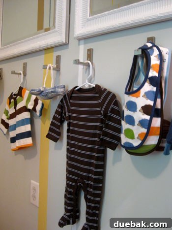 Nursery armoire next to a closet with a built-in nook