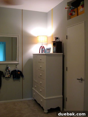 Close-up of the built-in nook above the closet with yellow toy bins