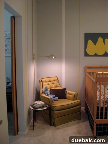 Newly decorated modern nursery with striped walls and a crib