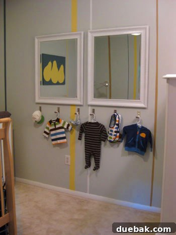 Close-up of Ikea fold-away hooks holding baby items