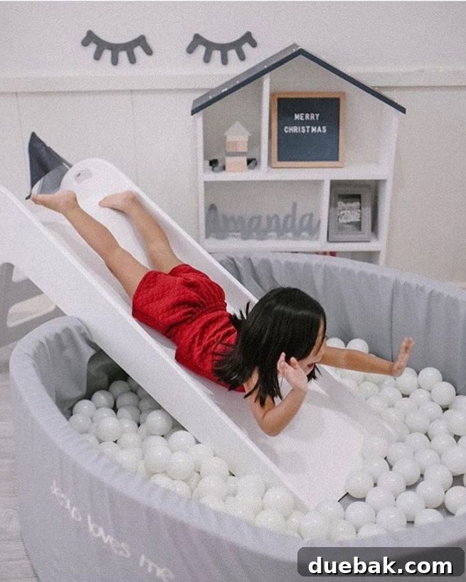 Whimsical Playroom Designs for Endless Fun 13 A sophisticated and modern monochromatic playroom featuring a stunning all-white ball pit, creating a dreamy, cloud-like play area for sensory engagement.