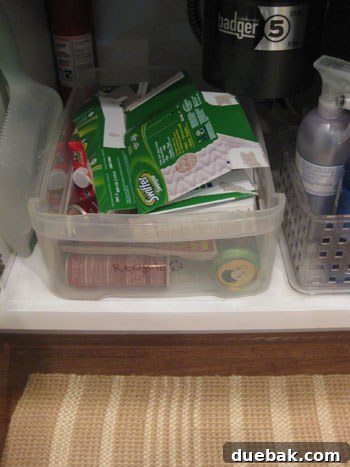 Microfiber Cloths: The Smart Upgrade from Swiffer Dusters 2 An empty box of disposable Swiffer duster pads in a recycling bin, symbolizing a shift towards sustainable cleaning.
