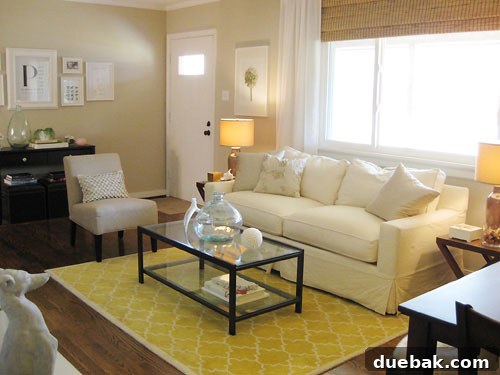 Close-up of a stylish living room corner featuring a unique framed 'P' print