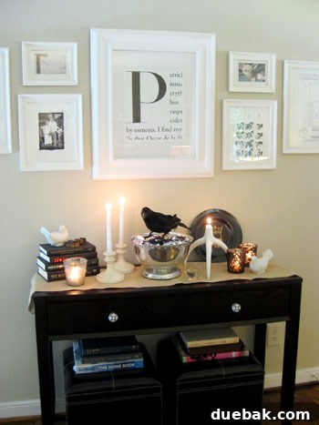 Elegant living room interior with a console table and a personalized framed initial