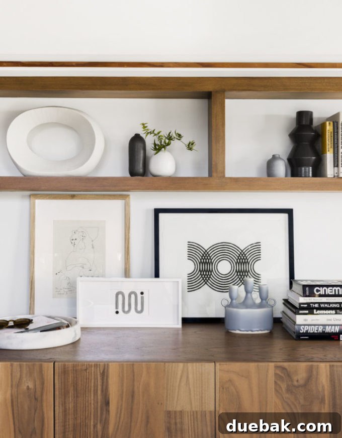 Elegant living room with a large, framed abstract art piece above a fireplace