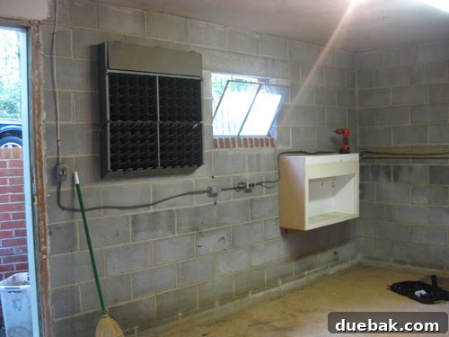 Another view of the unfinished basement with limited natural light