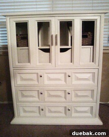 Stunning white painted dresser with new glass panels and hardware, after DIY makeover
