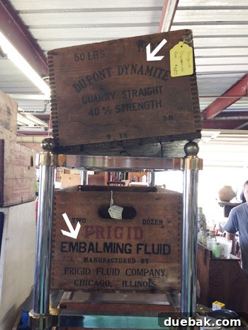 Antique wooden boxes with unique labels in a thrift store