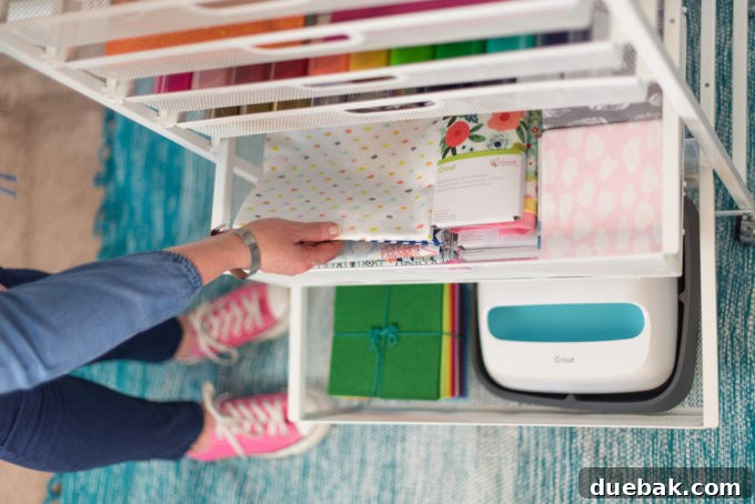 Beth Kingston's organized craft room featuring a convenient rolling cart for craft machines and supplies.