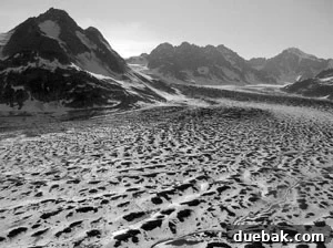 From Travel Snaps to Masterpieces 3 Desaturated black and white photo of an Alaskan glacier with volcanic ash