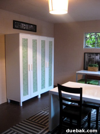 Dress Up Your Glass Doors with Gift Wrap 4 Organized storage bins inside a renovated basement armoire