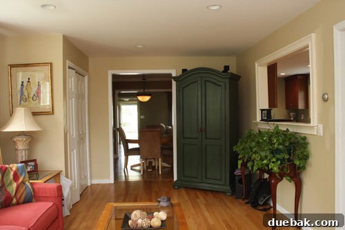 Close-up of the family room before, showing the wall color and general accessory style prior to the redesign.
