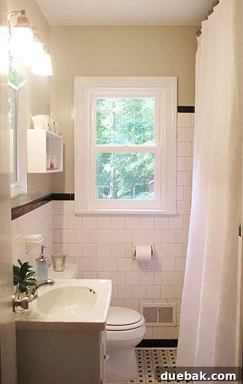 Vintage 1950s black and white tiled bathroom with basketweave floor