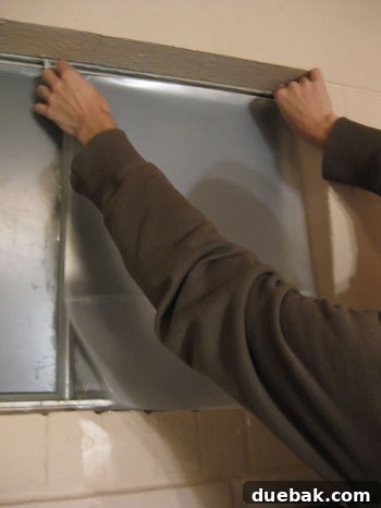 Window film initially applied to a window pane, showing overlap