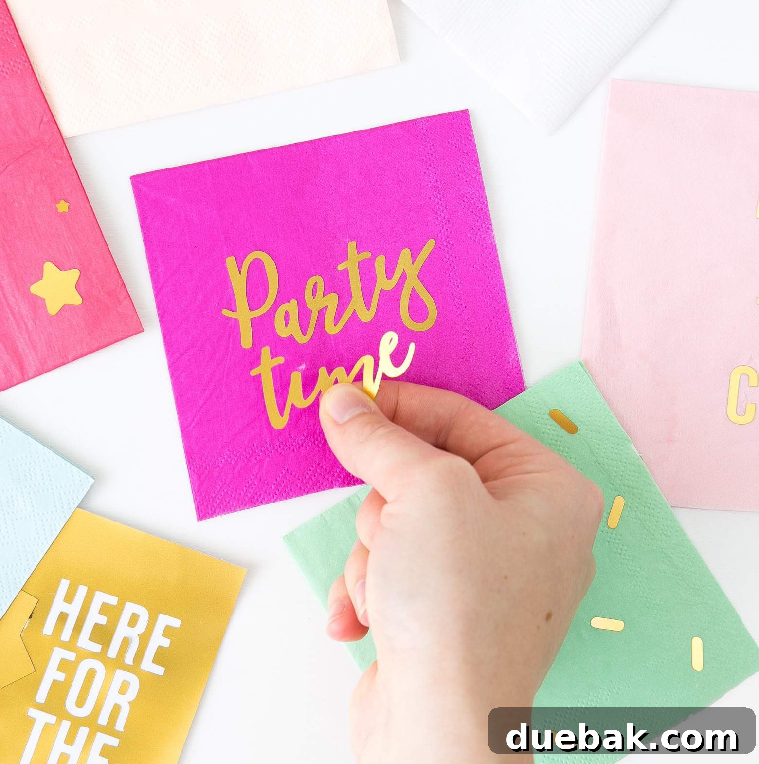 DIY gold foil napkins elevating party decor, a brilliant idea from Design, eat, repeat.