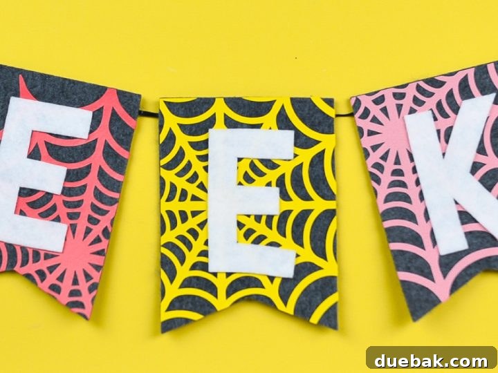 An easy felt Halloween banner created with iron-on vinyl, perfect for spooky decorations.