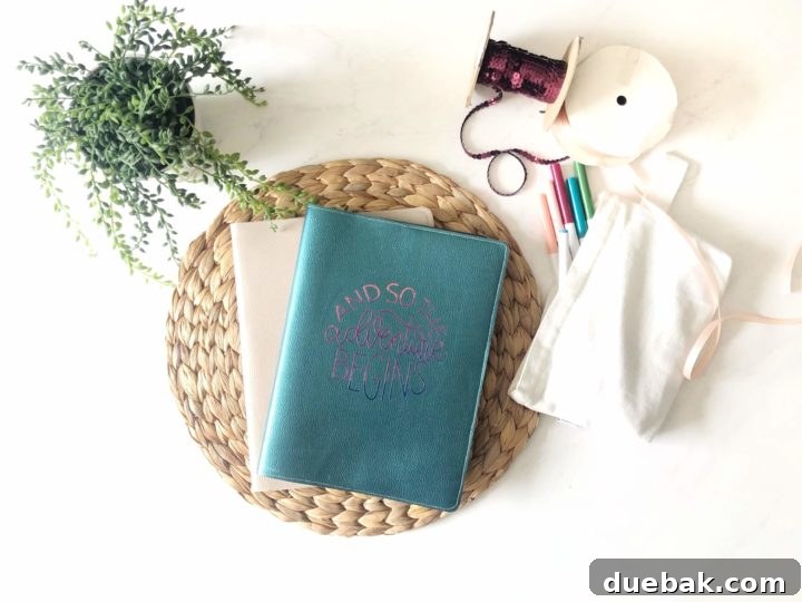 Custom journal cover created using foiled iron-on vinyl on faux leather, showcasing intricate details.