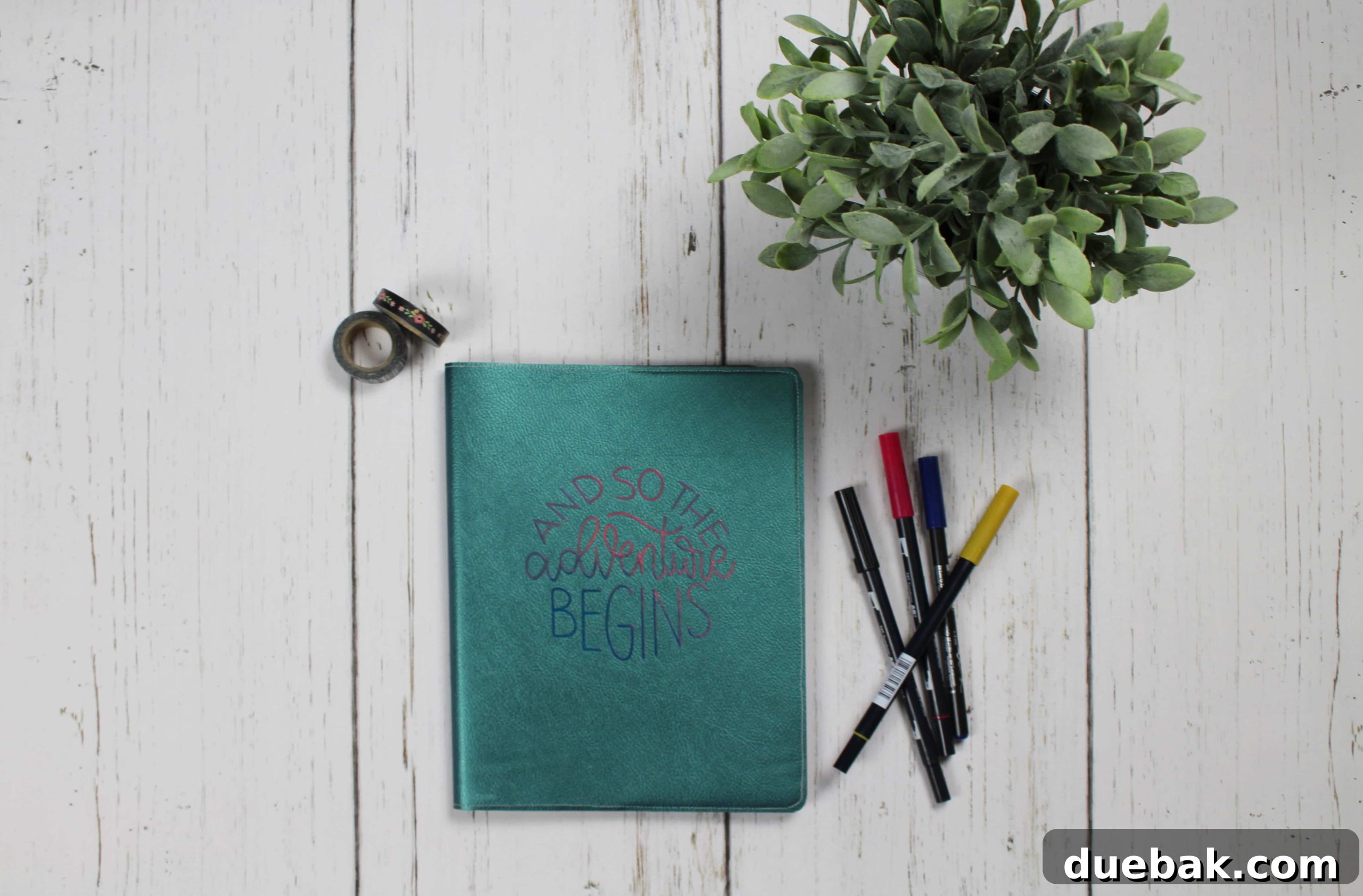 Materials laid out for crafting a faux leather journal cover