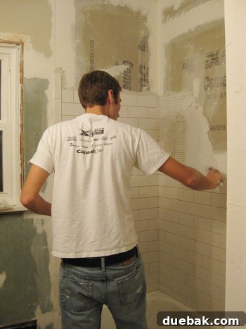Applying thinset mortar with a notched trowel for tile installation