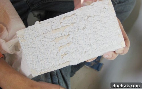 Cleaning excess thinset mortar from grout lines during tiling