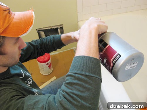 Close-up of grout being mixed in a bucket