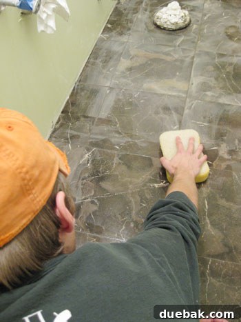 Attempting to remove grout haze with a damp sponge