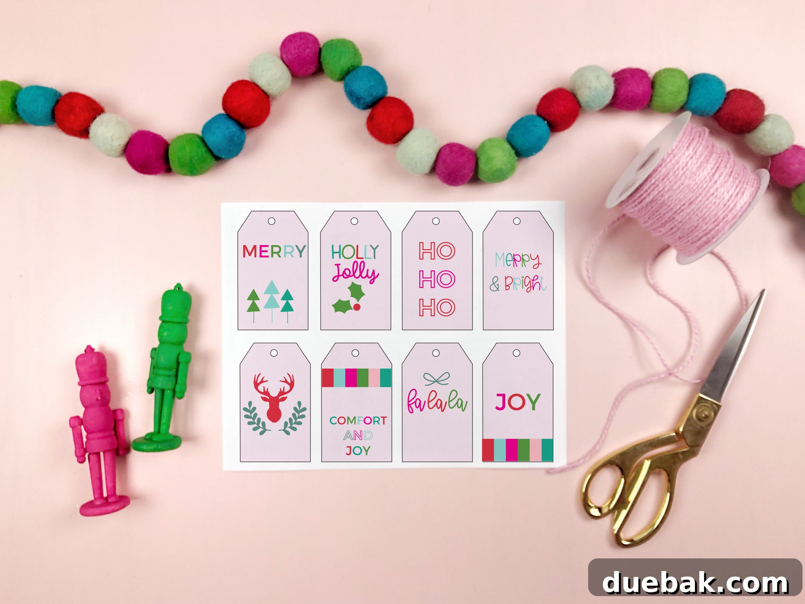 Vibrant DIY Christmas Gift Labels 2 A beautifully wrapped Christmas gift adorned with a vibrant, modern printable gift tag in pink, red, and turquoise.