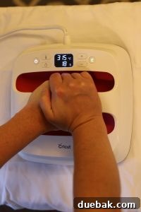 Applying iron-on vinyl to a pillowcase with a Cricut EasyPress