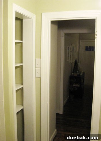 Elevate Your Bathroom Renovation with Flawless Baseboard and Trim Installation 15 Finished linen closet and door trim, seamlessly caulked and painted.
