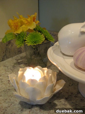 Creative faux fruit display on a kitchen counter with fresh flowers adding a pop of color
