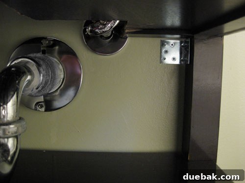 Securing DIY vanity to the wall with L-brackets