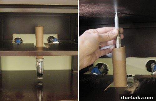 Using a paper towel tube to mark sink drain hole
