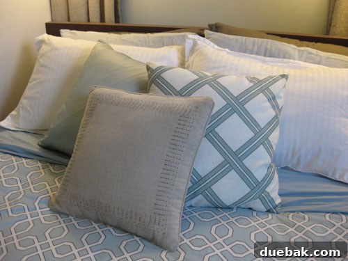 A collection of colorful throw pillows on a sofa