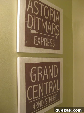 Crafting Vintage Wood and Paper Wall Signs 13 Finished vintage wood signs hanging in a bathroom