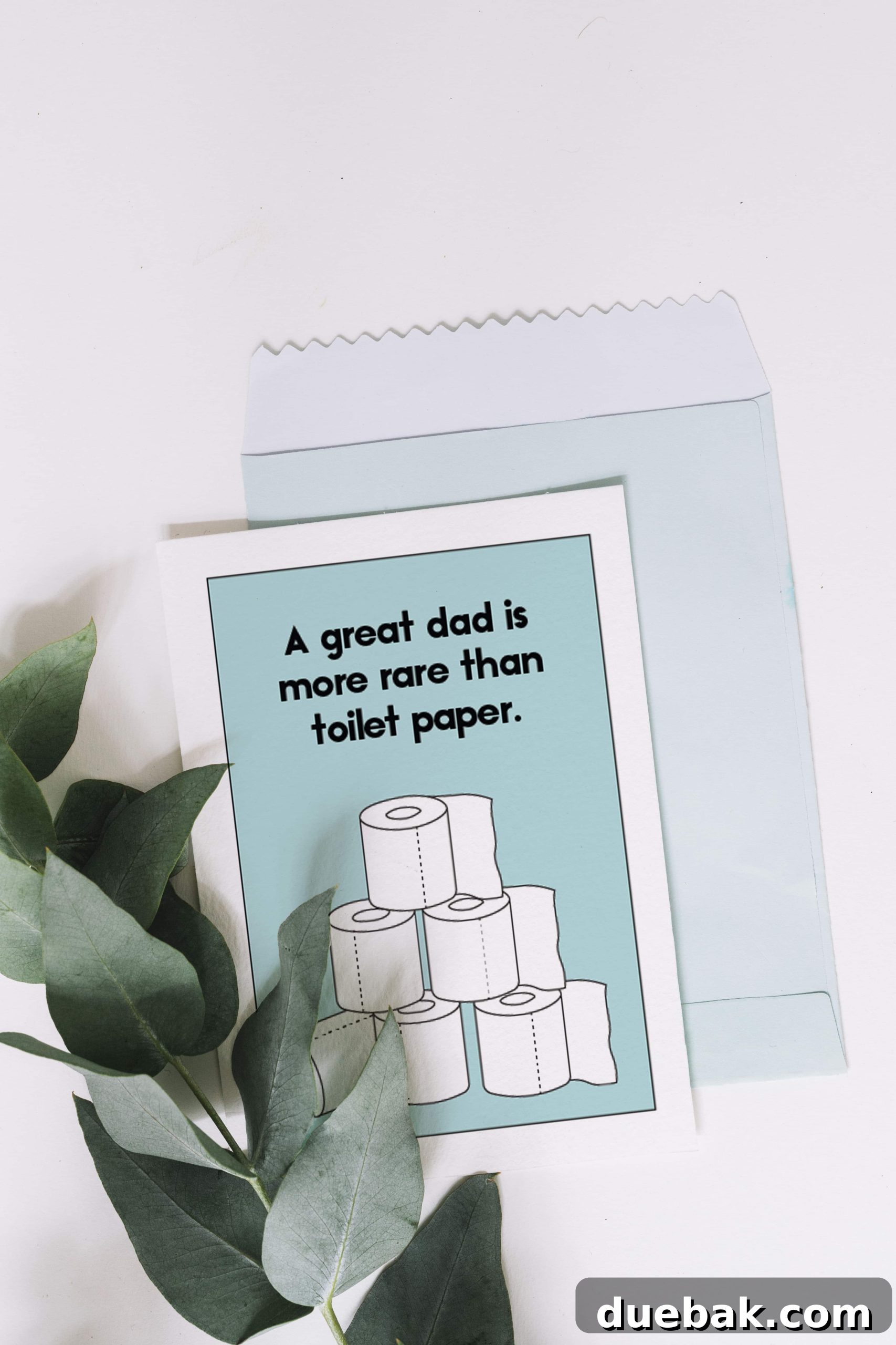 Printable Dad's Day Greetings 4 Close-up of a hand holding a printed Fathers Day card on cardstock, showing the quality of the print.
