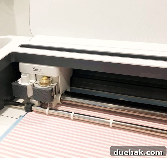 Cricut Maker FAQs Answered 4 Close-up of a Cricut Maker cutting fabric for a sewing project, highlighting precision.