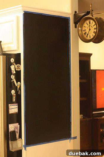 Craft Your Own Chalkboard Wall Calendar 2 Black chalkboard paint base coat applied to the kitchen wall for a DIY calendar