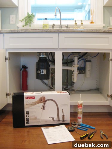 Under sink view before faucet removal