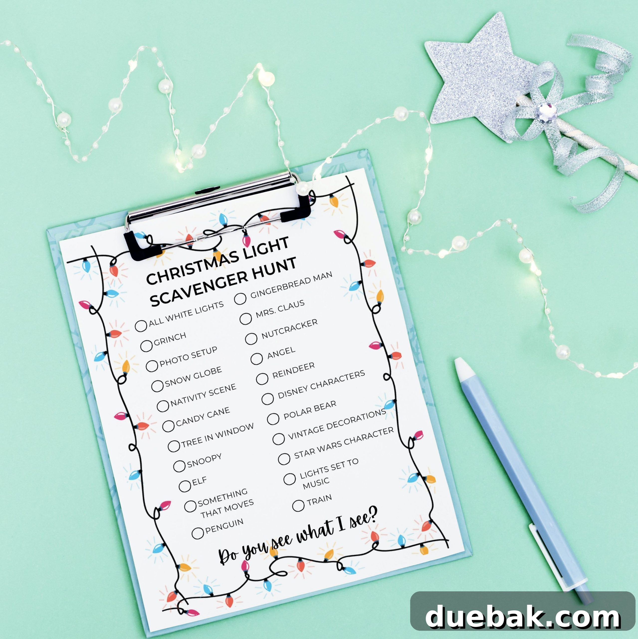 A festive Christmas wishlist or Santa letter on a mint-colored background, adorned with a cozy New Year garland and sparkling decorations. Perfect for inspiring holiday dreams and planning your festive light hunt.