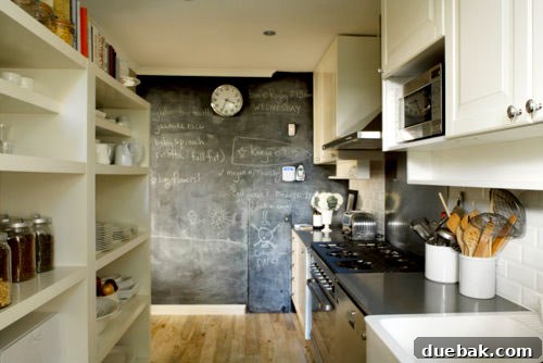 Sydney Architectural Marvel: A Home Unveiled 2 Stylish kitchen with chalkboard wall and open IKEA shelving