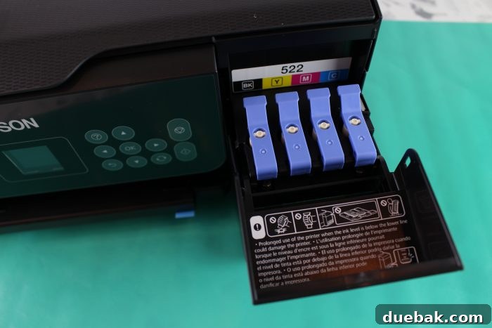 Unlock Sublimation Printing with Your EcoTank 10 Close-up of an Epson EcoTank printer's ink tank lid, revealing the color label.