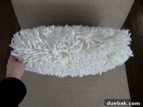 The finished shag rug pillow, showing no visible signs of the safety pins.