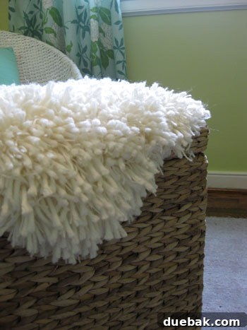 A close-up view of the faux sheepskin rug, highlighting its rich, shaggy texture.
