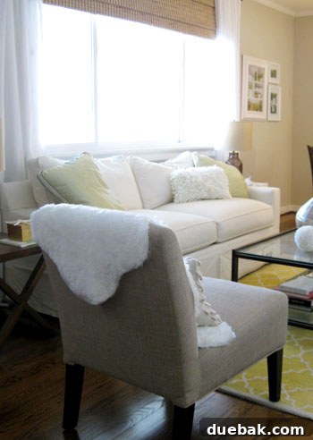 Faux Sheepskin Rug: The Finishing Touches 9 Faux sheepskin throw draped over the back of a living room chair, adding layered texture.