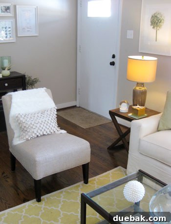 Another perspective of a faux sheepskin throw enhancing the comfort and style of a living room chair.