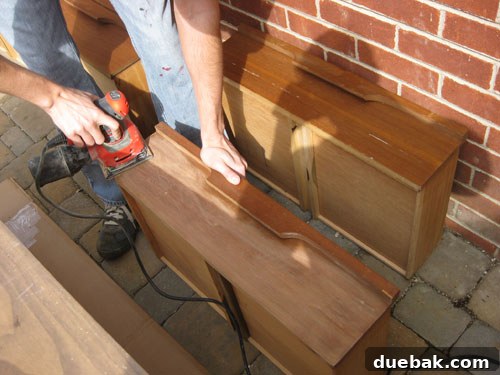 Sanding Dresser Top with Electric Sander