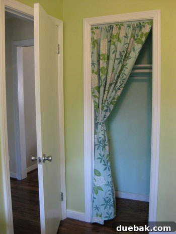 Nursery closet with painted rod and shelf, and a new curtain