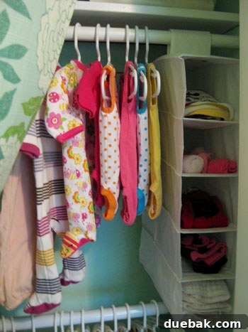 Customized IKEA shoe organizer cubbies in the nursery closet